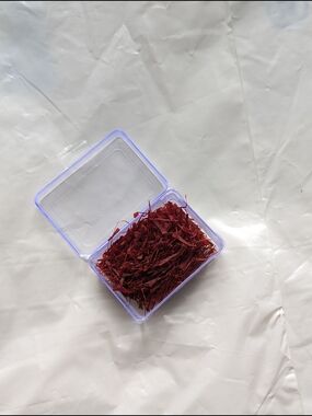 Saffron-Style Red Floral Threads in Clear Storage Box